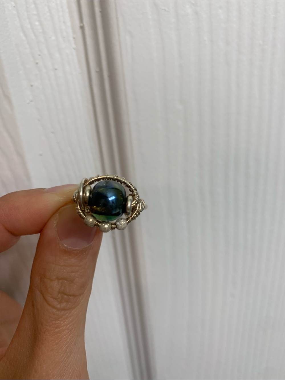 Handcrafted Silver Wire Ring with Iridescent Blue-Green Glass Bead
